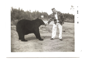 That would be the Wanderer, holding a can to feed the black bear. See Photo -developed August 1961.